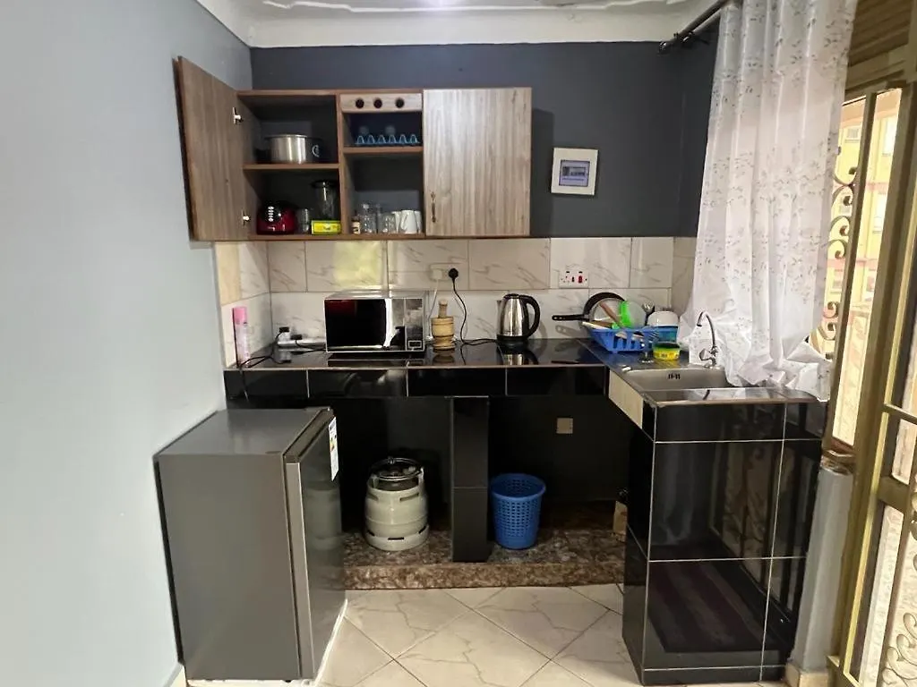 Cozy Suites Kampala Appartement